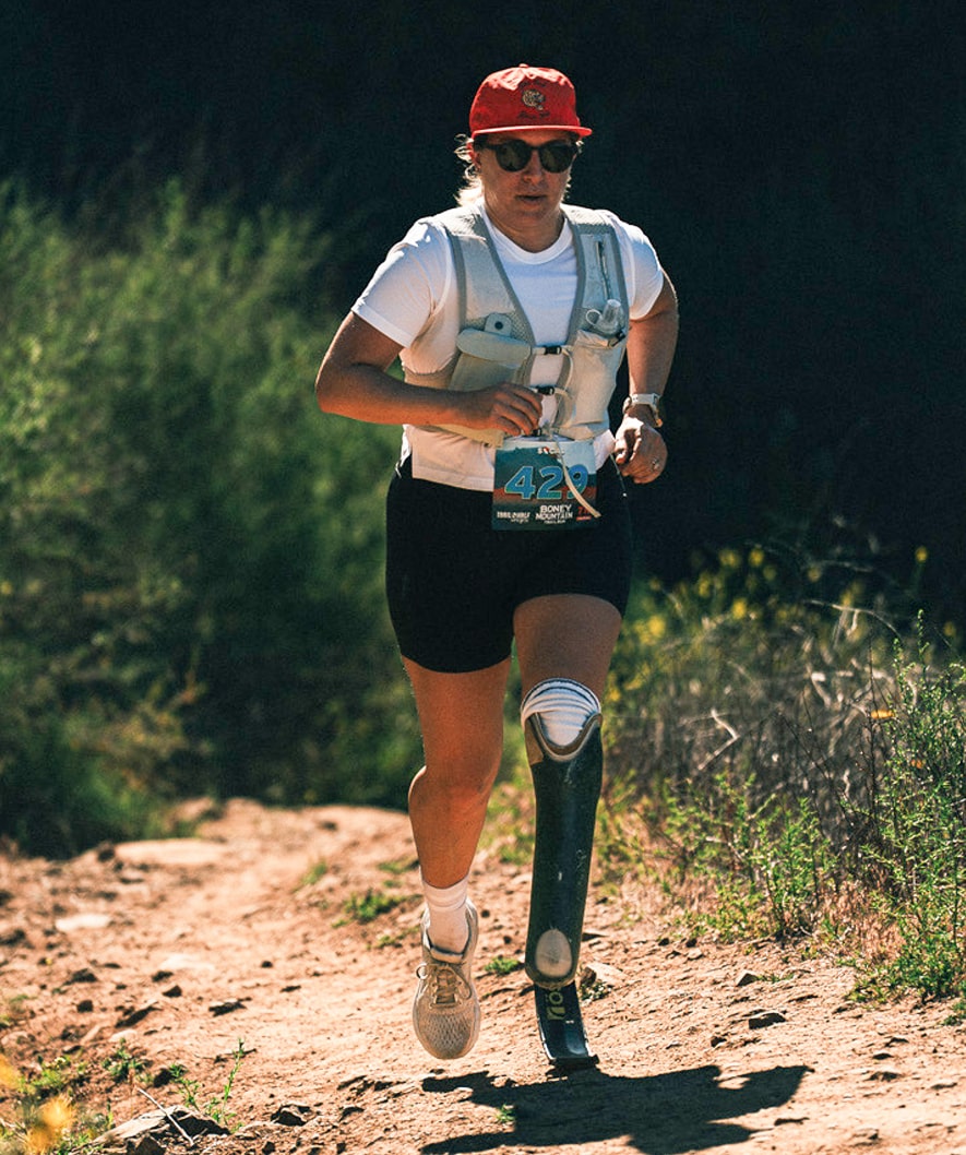 Danielle McLaughlin runs up a hill on a trail run. Danielle McLaughlin runs up a hill on a trail run.