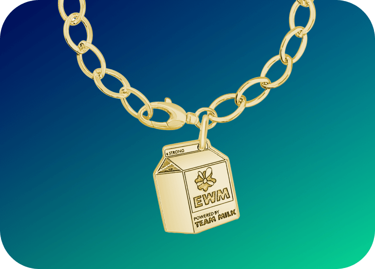 A brightly lit Erica Sara x Every Woman's Marathon collab charm bracelet with a mini milk carton charm against a blue and green gradient.