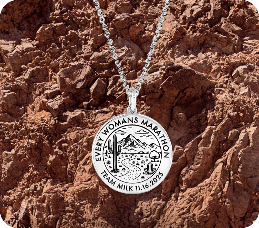 Every Woman's Marathon desert landscape charm on necklace.