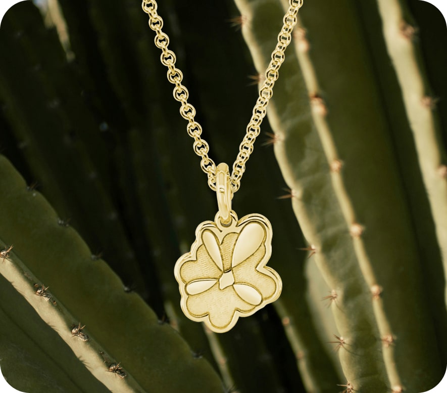 Every Woman's Marathon logo emblem charm on necklace.