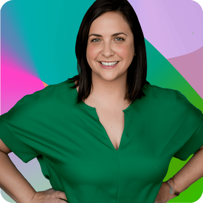 MALAIN MCCORMICK, Race Director, smiling with hands on hips in a green blouse against a colorful abstract background. 