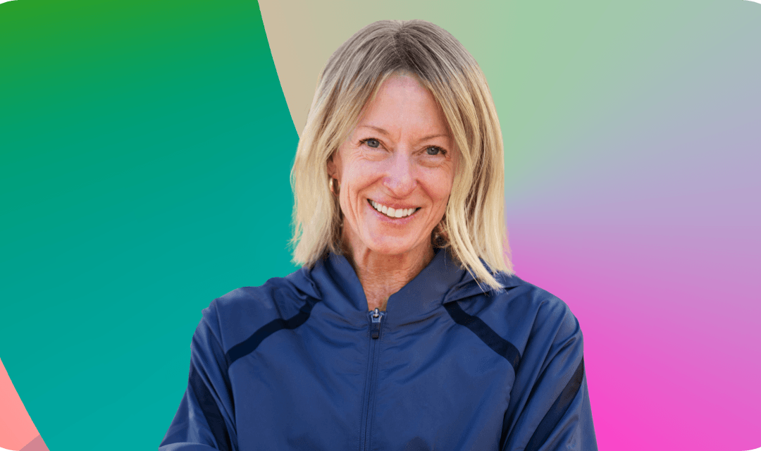 Portrait of Deena Kastor on a gradient background.